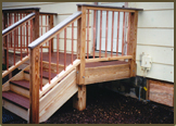 Back Porch with Composite Flooring,Treads,Drinkcap,and Copper Pickets.